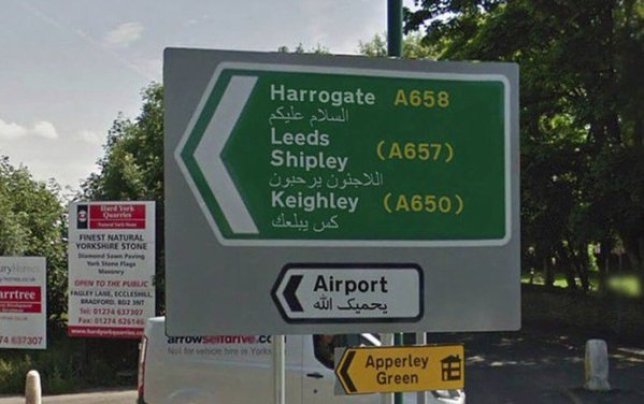 People are fuming over a photo of a British road sign featuring Arabic… only it’s a fake!