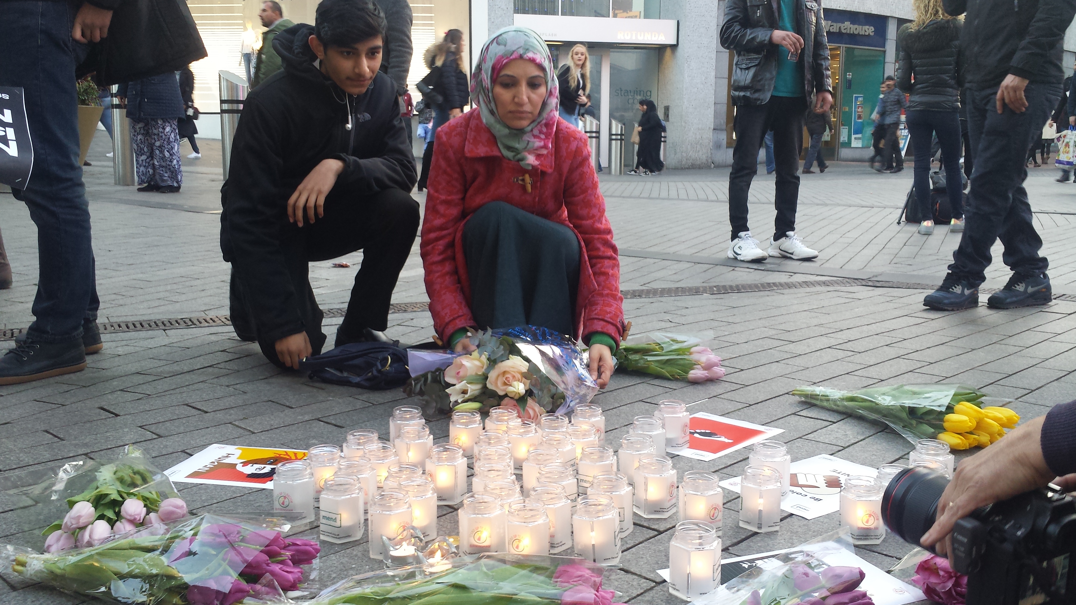 Birmingham anti-war campaigner and former city councillor Salma Yaqoob lays flowers during a vigil for the victims of the Westminster attacks in London (Photograph: Adam Yosef)