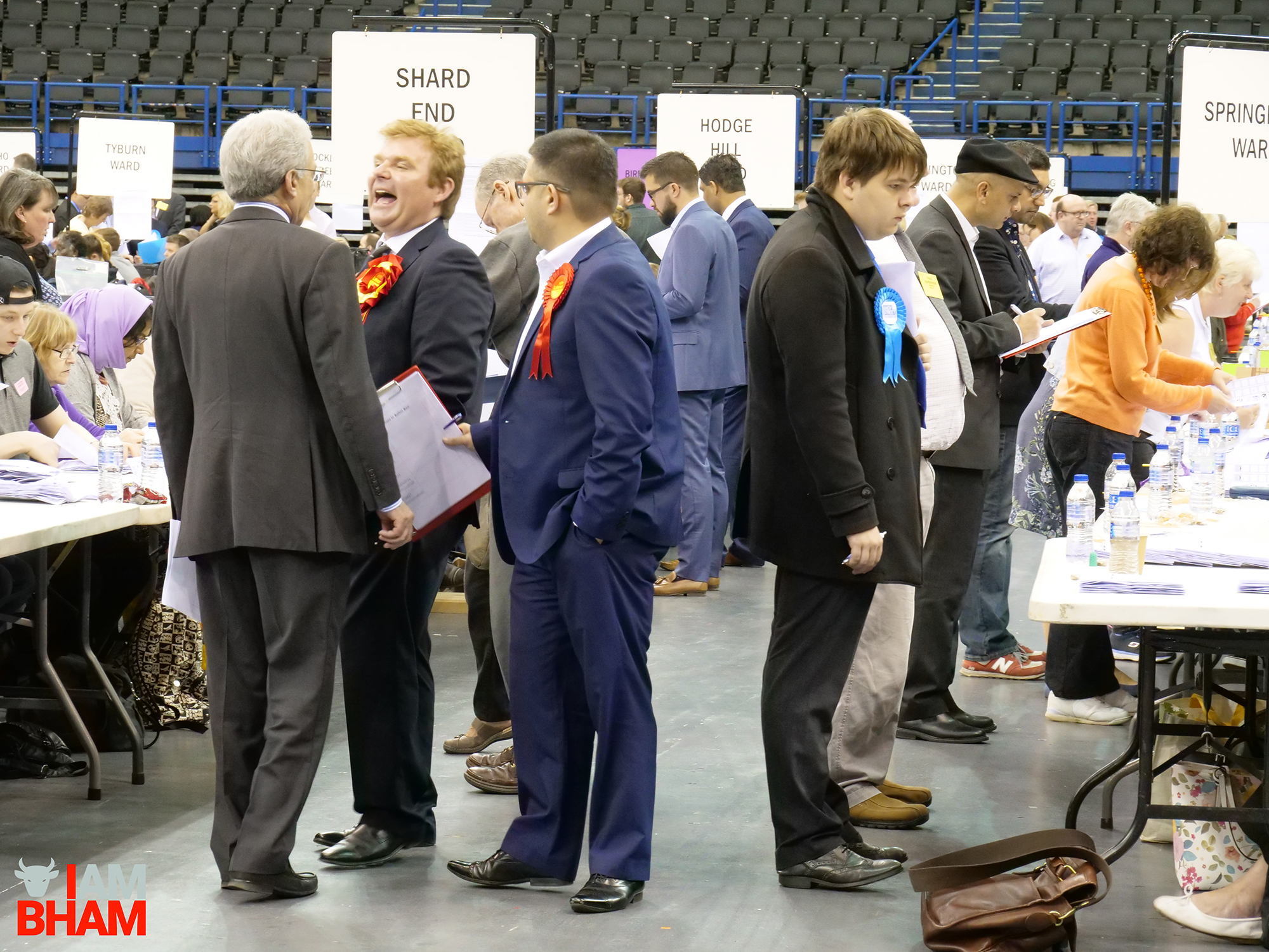 Labour councillors chat during the West Midlands Mayoral Election vote count at the Birmingham Barclaycard Arena
