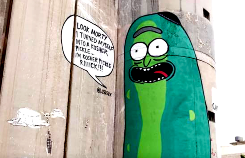 Graffiti artist paints giant ‘Pickle Rick’ on Israeli segregation wall