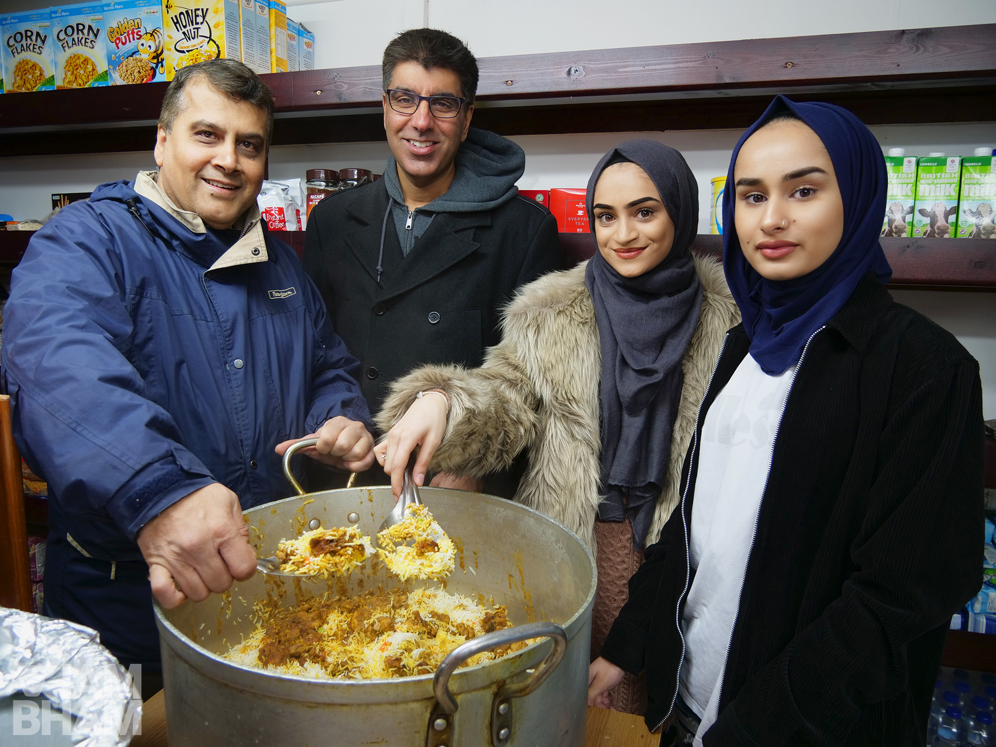 (L-R): Shahed Syed and Riaz Hanjra from Birmingham Outreach Foundation with volunteers Huma Chishti and Aidah Chishti