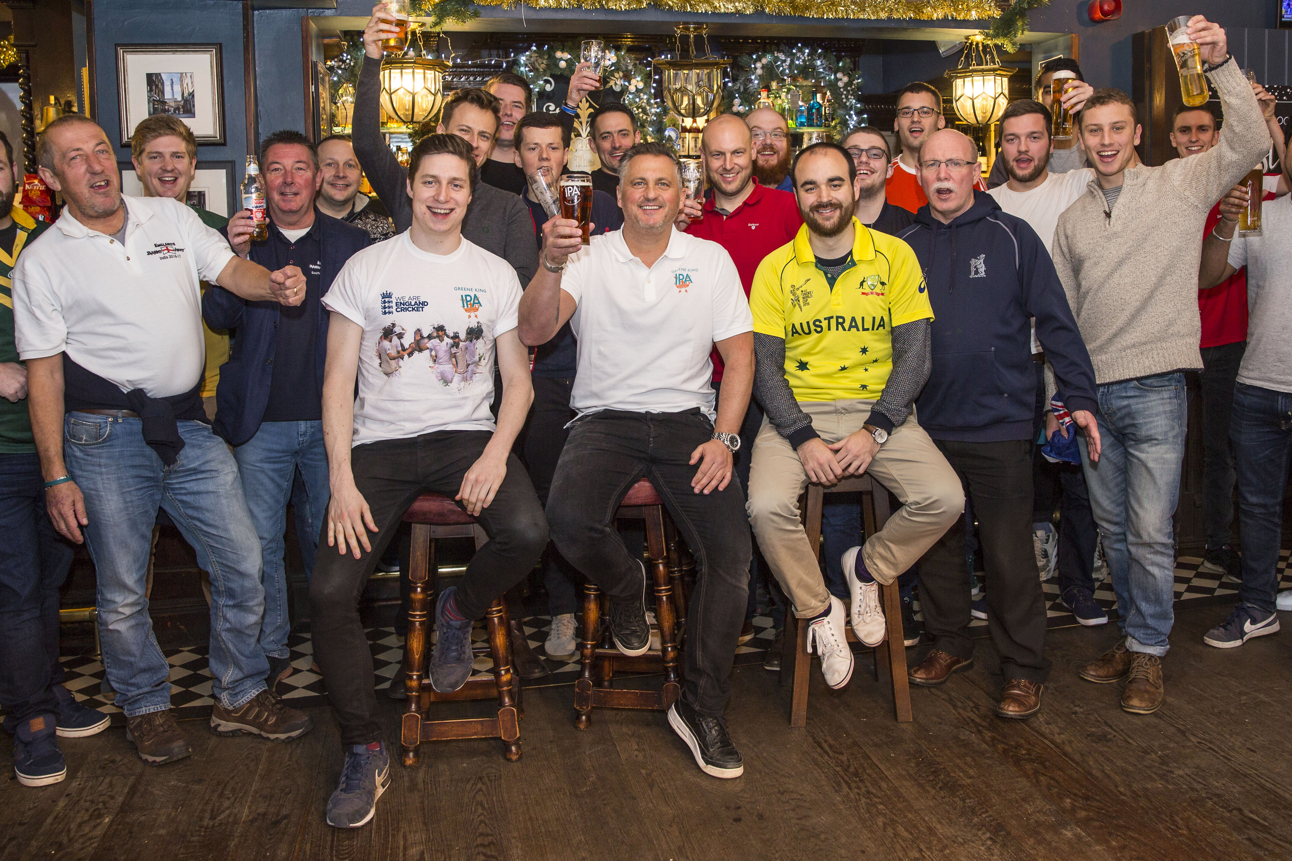 Retired English cricketer Darren Gough with a select group of fans at a pub in London