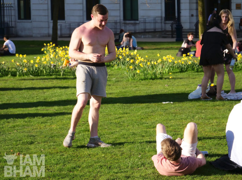 Two lads having a playful tussle in Pigeon Park (Cathedral Square) in Birmingham