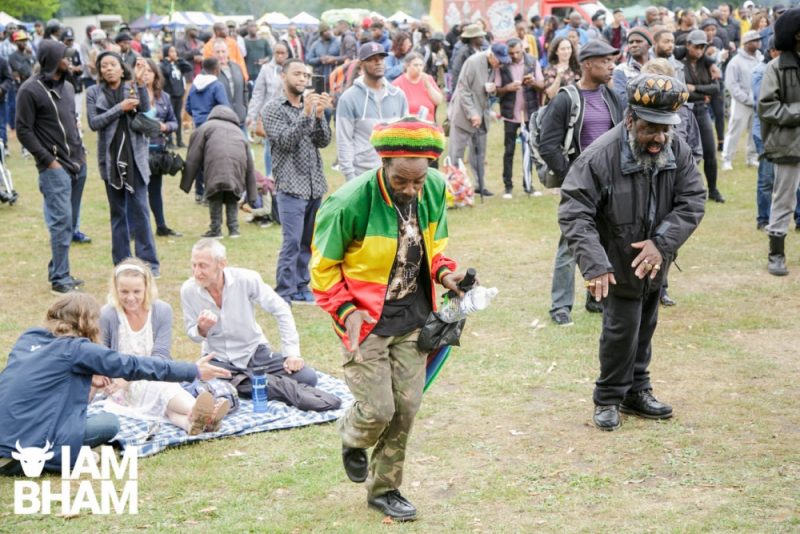 A festival goer enjoying Simmer Down Festival 2018