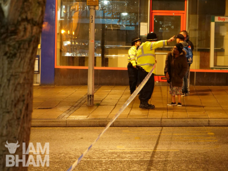 Police officers redirecting pedestrians on a sealed off Bull Street in Birmingham city centre