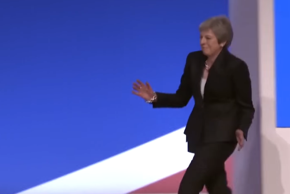 Theresa May walks on stage at Tory conference dancing “like a demented windmill”