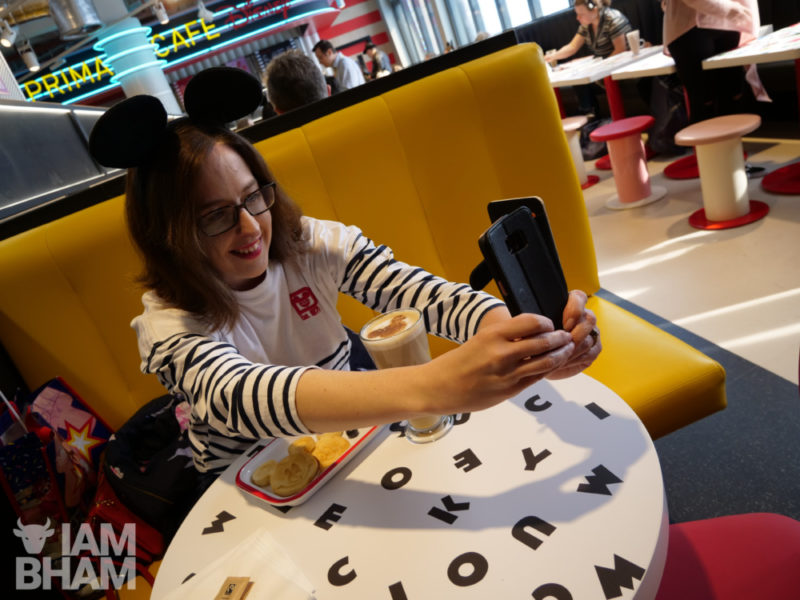 A customer photographs her Disney themed meal at the new Primark in Birmingham 
