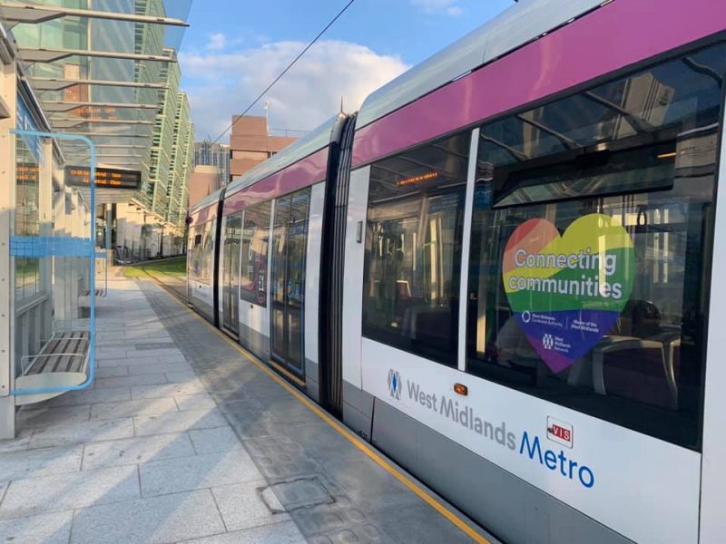 A Birmingham tram displays the connecting communities overlay at New Street Station.