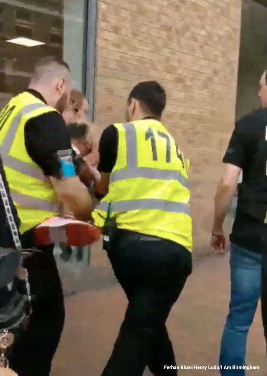 Several members of the Birmingham Pride security team grabbed Ferhan Khan off his hands and feet to carry his away