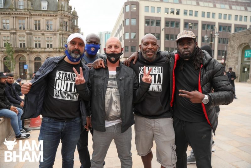 Former football hooligan Barrington 'One Eye Baz' Patterson poses with fellow BCFC fans at the anti-racism march