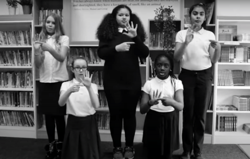 School students performing Joe Cook's poem Lock Pickin' on British Sign Language (BSL) 