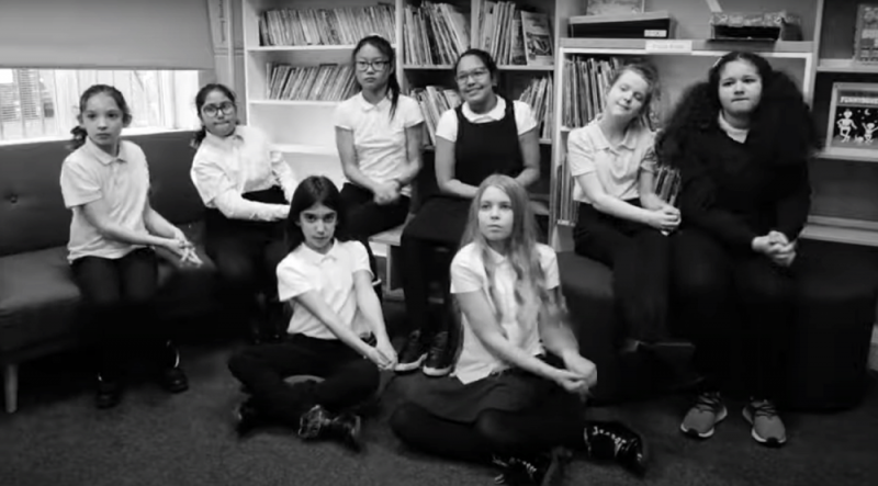 School students performing Joe Cook's poem Lock Pickin' on British Sign Language (BSL) 
