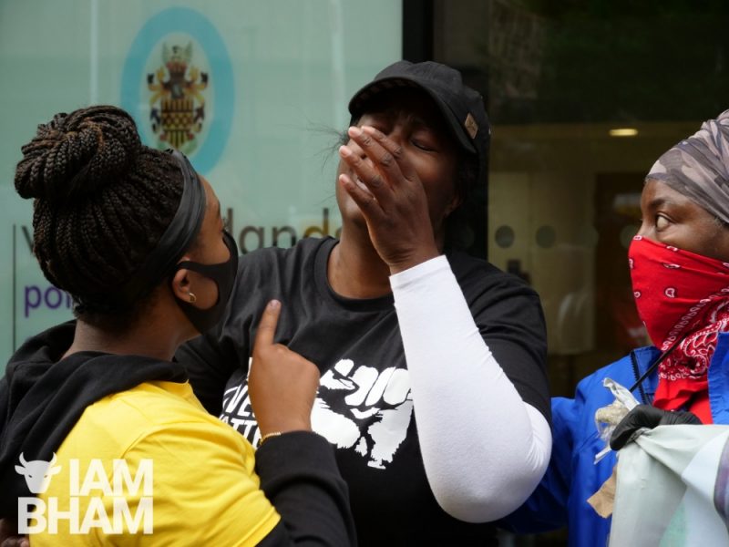 A mother of a victim of police brutality cries outside West Midlands Police HQ last month 