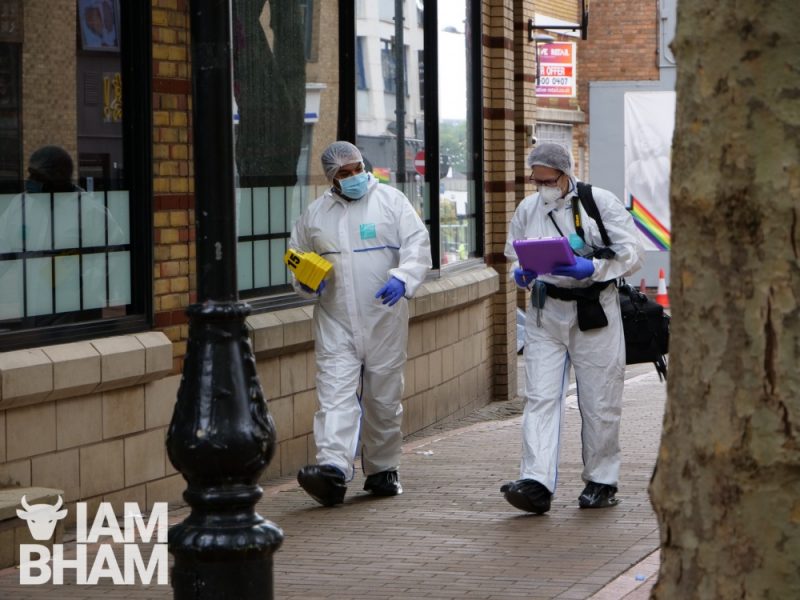 Forensics scientists collect evidence along Hurst Street in Birmingham 