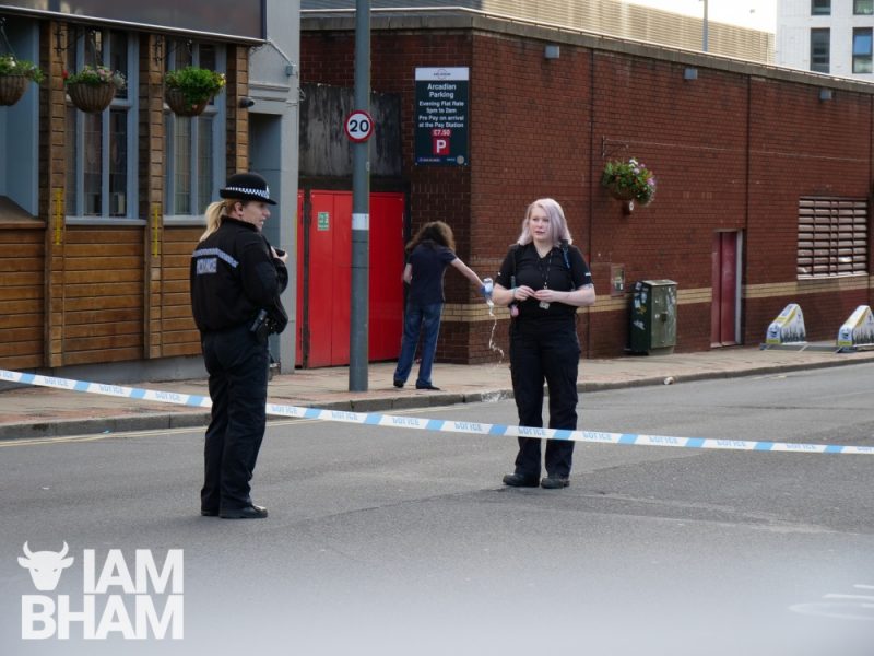 A police woman speaks to a colleague in Hurst Street in Birmingham 