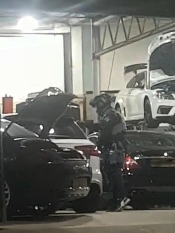Armed police officers executed a firearms warrant at the MSL garage last night