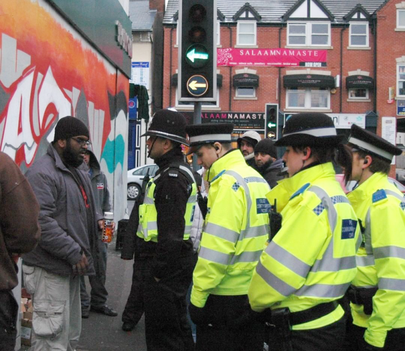 Mohammed 'Aerosol Arabic' Ali is confronted by police while painting a ‘Free Gaza’ Palestine mural in Small Heath in 2009