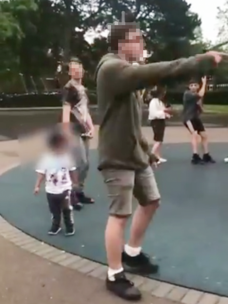 Little children watch in horror as the racists hurl abuse at the Muslim family