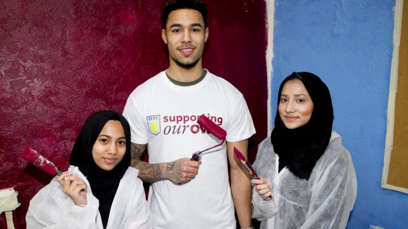 AVFC footballer Andre Green with young volunteers at Saathi House in Birmingham