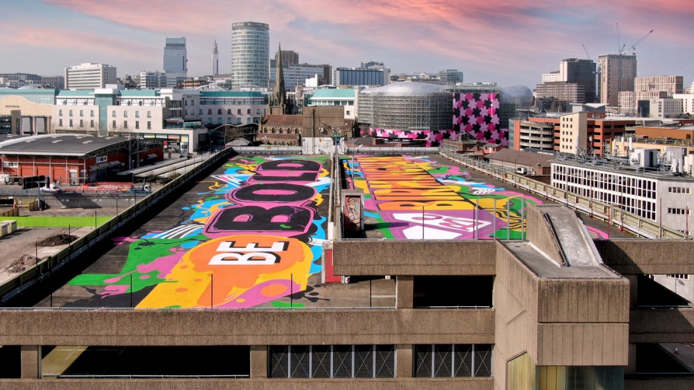 Graffity artwork for the Commonwealth Games on top of Digbeth building overseeing Birmingham 