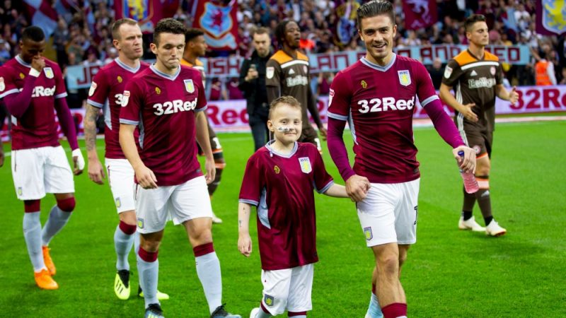 Football star Jack Grealish and young Josh Nicholson ahead of an Aston Villa football match