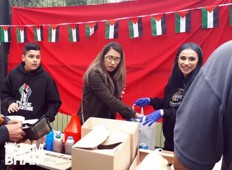 Volunteers sharing street food to help fundraise for families in Palestine 