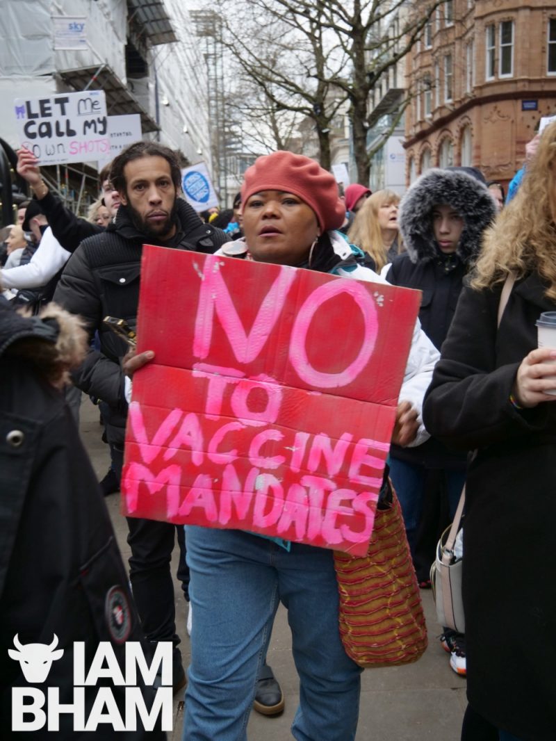 A protesters displays a 'No to vaccine mandates' sign in Birmingham 