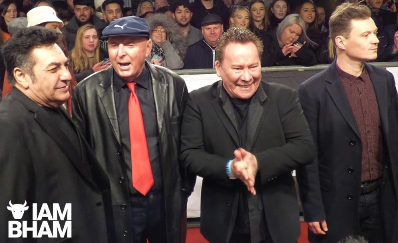 Jasper Carrot (in red tie) chatting to UB40 band members