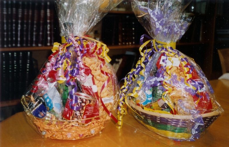 Gaily wrapped baskets of sweets, snacks and other foodstuffs given as mishloach manot on Purim day