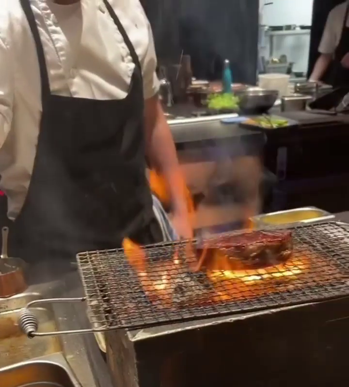 A cook at the Opheem restaurant prepare Michael Bublé's dish