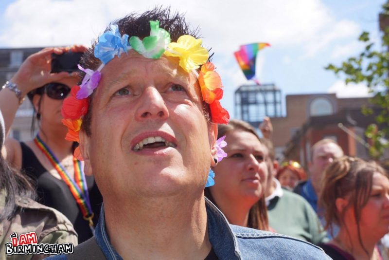 Man with rainbow headdress during Pride 
