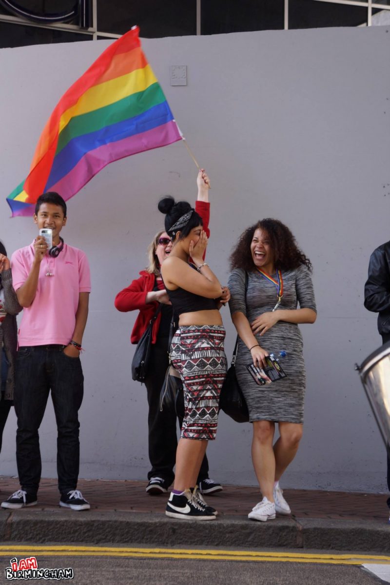 Waving the rainbow Pride flag in Birmingham 