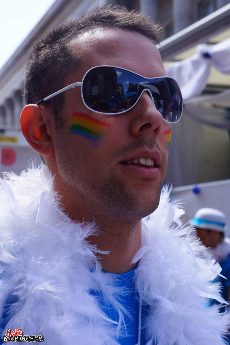 Young man with rainbow face paint