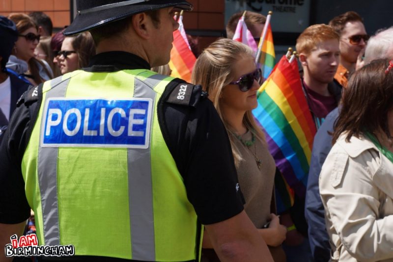 A policeman stands watch as the Pride parade passes by in Birmingham