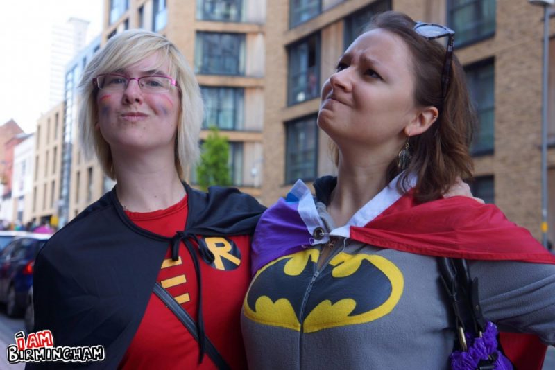 Two Pride attendees dressed as Batman and Robin 