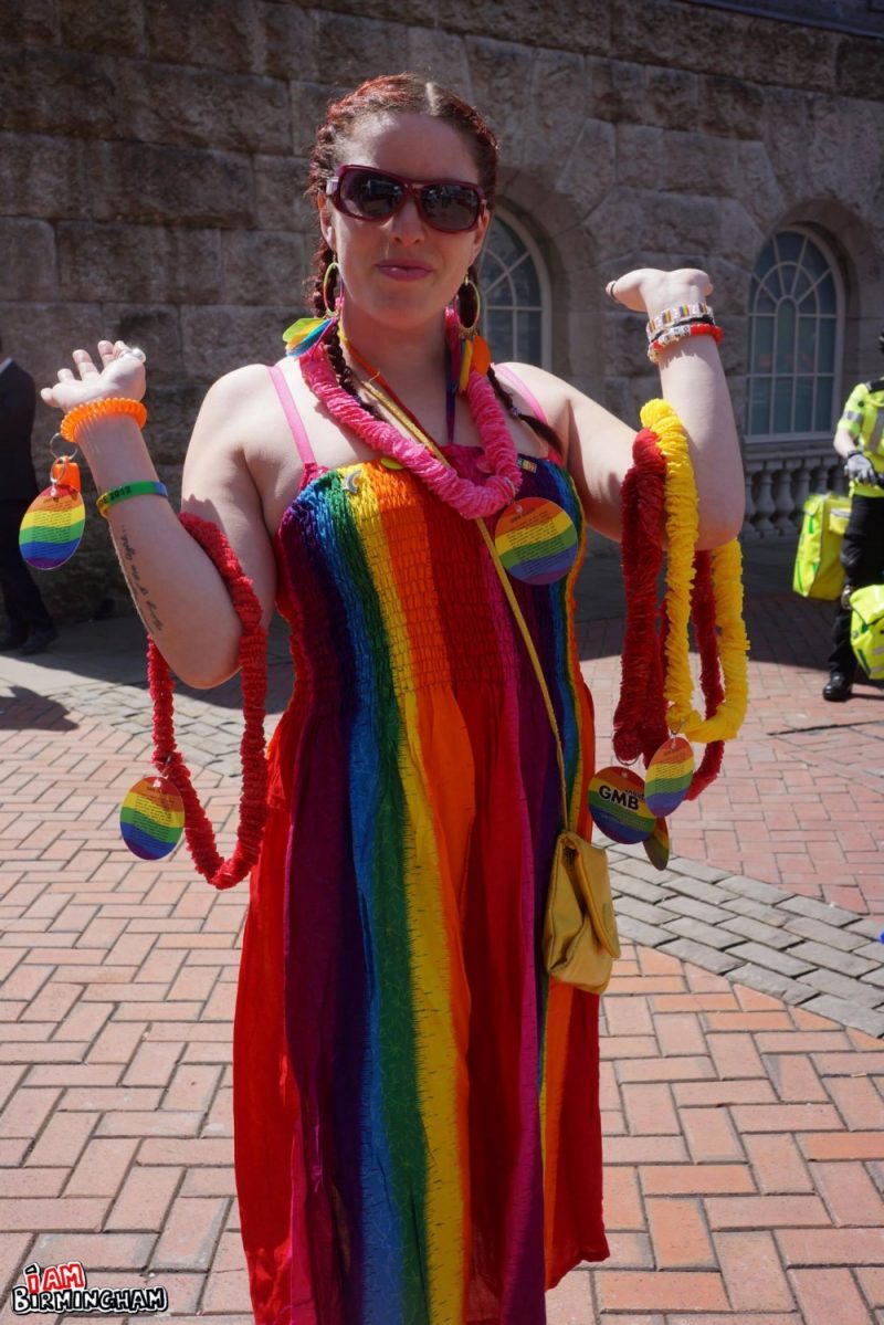 A person with rainbow dress and accessories during Birmingham Pride 2013 