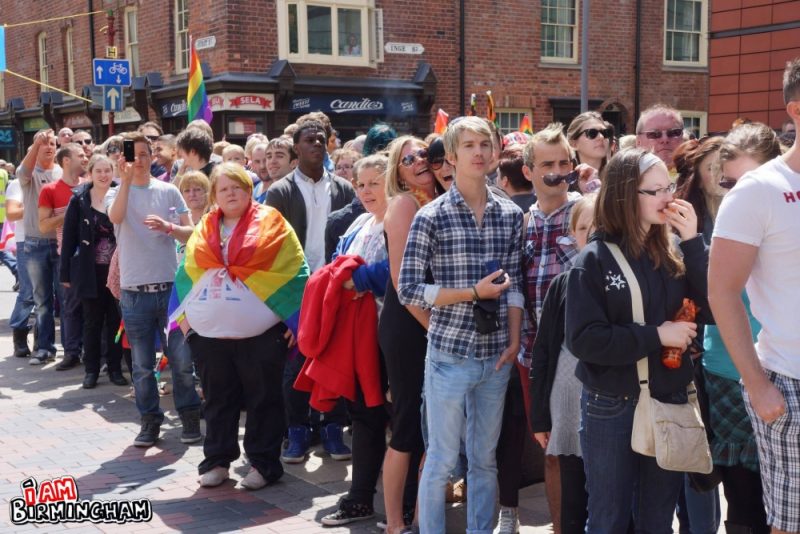 Spectators watch the Birmingham Pride parade 