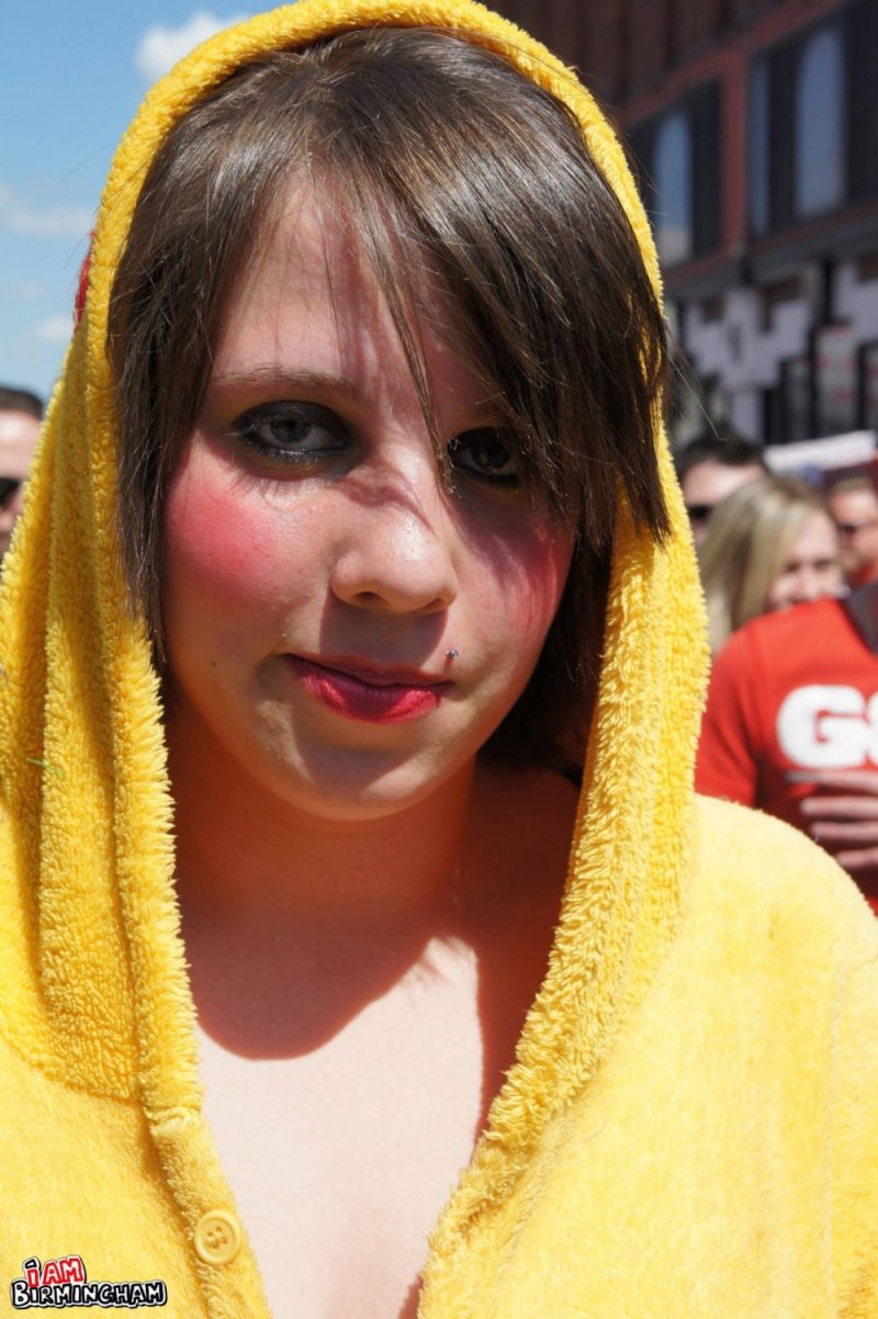 Young person in a yellow onesie at Birmingham Pride