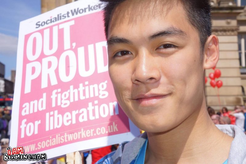 'Out and Proud' Socialist Worker placard banner at Birmingham Pride 