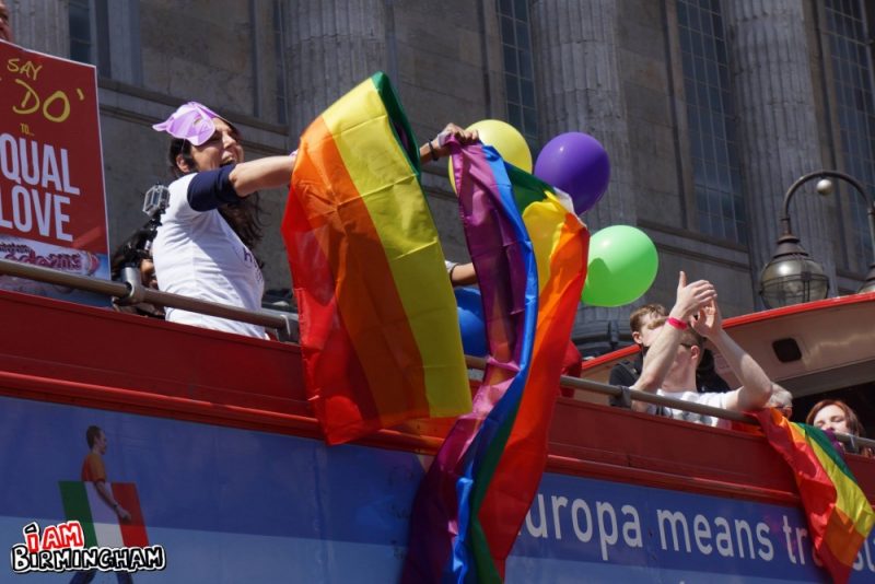 Pride float and rainbow flag 