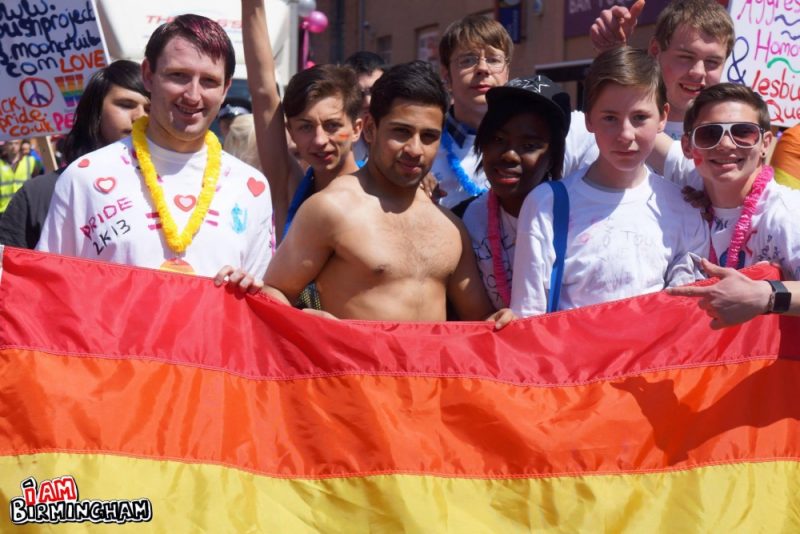 Young men with rainbow flag 