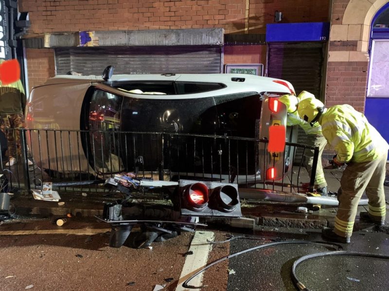 The crash resulted in traffic lights toppling over and the vehicle ended up on the pavement
