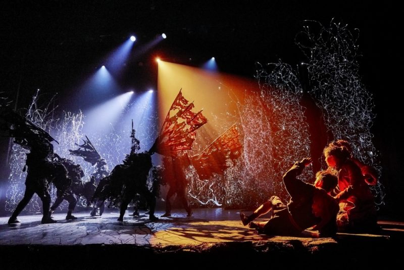 The play uses lighting, music, sound and movement to conjure up another world
