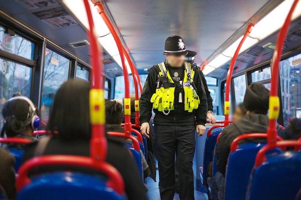 West Midlands Police officers inspect a bus (file image)